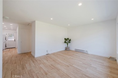 Welcome Home to this Beautifully Maintained Updated End-Unit - photo 7