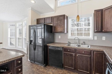 This beautiful home is set on nearly one acre of fully fenced