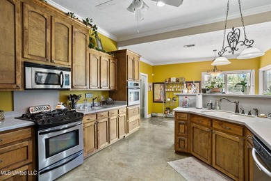 This custom-built equestrian property in Terry offers a - photo 22