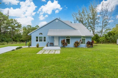 (private lake, pond, creek) Home For Sale in The Acreage Florida