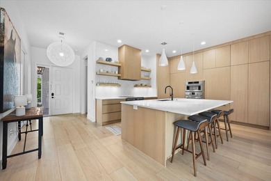 Wake up in this elegantly renovated villa tucked within the most - photo 3