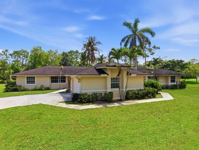 Welcome to your private oasis in the desirable Acreage area of - photo 1