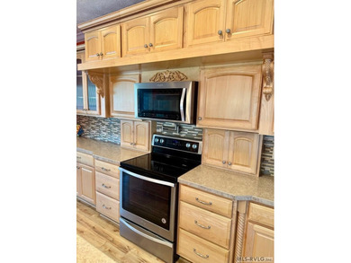 Own a beautiful LAKE House on 4.25 Acres with a gentle slope to - photo 4