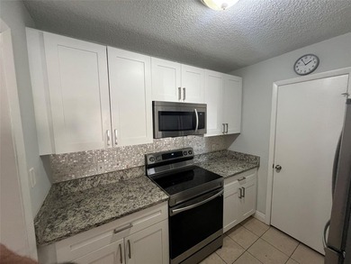 ALL AGES GATED COMMUNITY FIRST FLOOR UNIT TOTALLY REMODELED WITH - photo 9