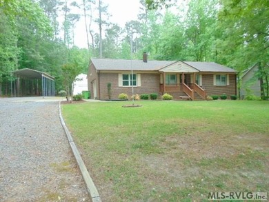 Wonderful brick ranch with a water view located in a nice - photo 1