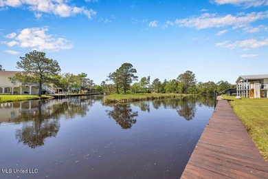 Located on a spacious waterfront lot in Bay St. Louis, this - photo 3