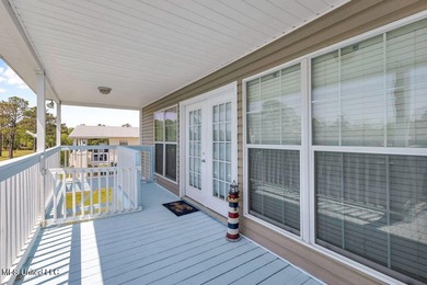 Located on a spacious waterfront lot in Bay St. Louis, this - photo 5
