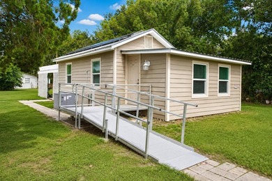 PAID OFF SOLAR + OVERSIZED LOT + METAL ROOF + WATER FILTRATION - photo 1