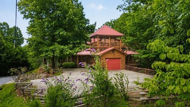 Tucked into a private wooded setting on top of the mountain in - photo 16