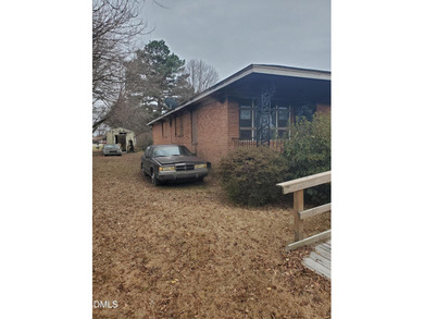 Investment Opportunity! Come rebuild this brick ranch home in a