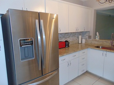 FIRST FLOOR. MOVE IN READY. COVERED PARKING. IMMACULATE JUMBO - photo 2