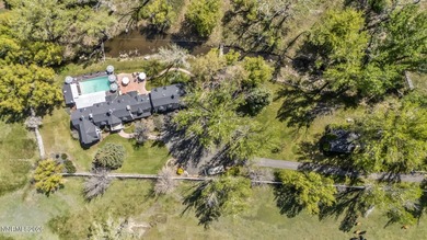 Behind a private tree lined drive in Holcomb Ranch lies a rare - photo 46