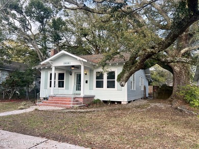 Walk to the beach, park, and community center from this charming - photo 1