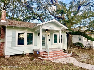 Walk to the beach, park, and community center from this charming - photo 2
