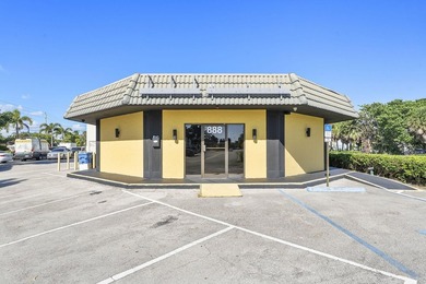 Prime location alert! This free-standing retail building with - photo 2