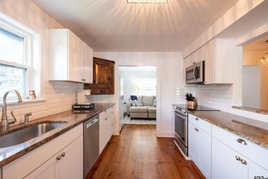 Main lake waterfront with private dock, updated interior, and - photo 11