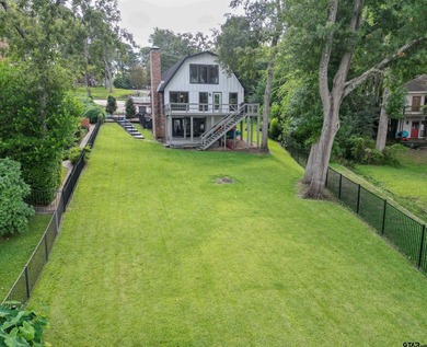 Main lake waterfront with private dock, updated interior, and - photo 35