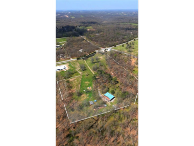 10 Acres in a Prime NWA Location, Endless Potential. Rare - photo 1
