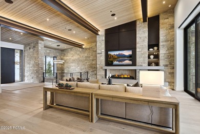 This newly completed estate sits on one of the premier homesites