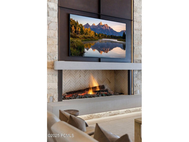 This newly completed estate sits on one of the premier homesites