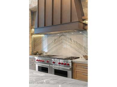 This newly completed estate sits on one of the premier homesites