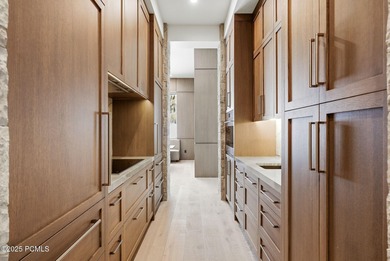 This newly completed estate sits on one of the premier homesites