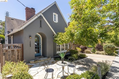 This picturesque Tudor home is located on a quiet tree-lined - photo 2