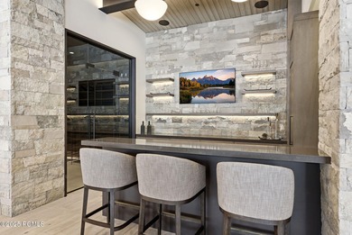 This newly completed estate sits on one of the premier homesites