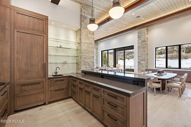 This newly completed estate sits on one of the premier homesites