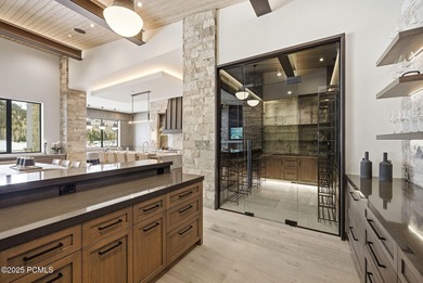 This newly completed estate sits on one of the premier homesites