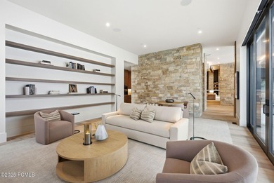 This newly completed estate sits on one of the premier homesites