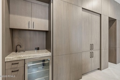 This newly completed estate sits on one of the premier homesites