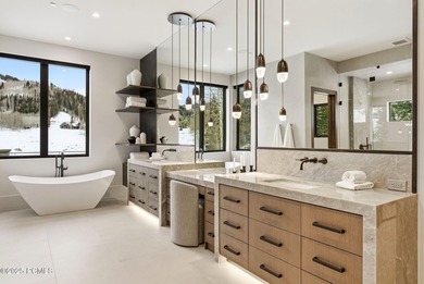 This newly completed estate sits on one of the premier homesites