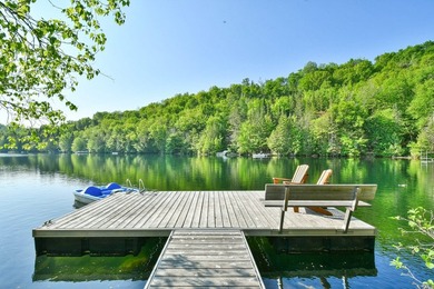 Ready to welcome you for the summer, this stunning waterfront - photo 2