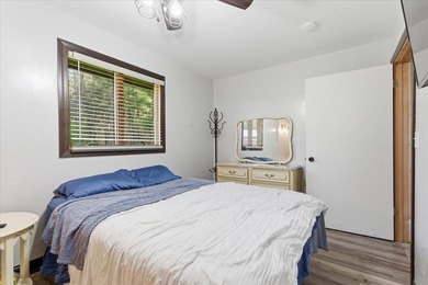 Tucked among towering trees on 2.5 wooded acres at the end of a - photo 12