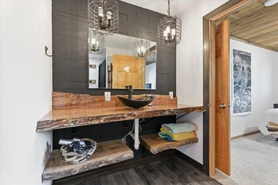 Tucked among towering trees on 2.5 wooded acres at the end of a - photo 18