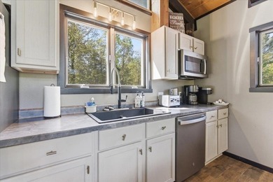 Tucked among towering trees on 2.5 wooded acres at the end of a - photo 39