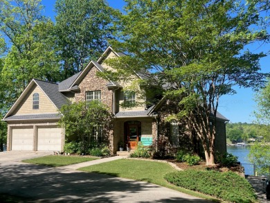 This exceptional 5-bedroom lake retreat in the highly coveted - Lake Home For Sale in Crane Hill, Alabama