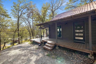 Enjoy lake life the way it's meant to be in this cozy cabin with - photo 30