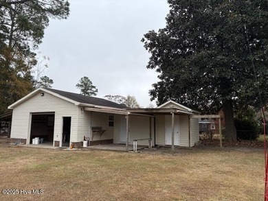 Well maintained 3 bedroom brick home with LOTS of outside