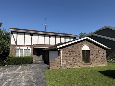 Opportunity awaits with this spacious two-story lakefront home - photo 1