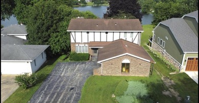 Opportunity awaits with this spacious two-story lakefront home - photo 2