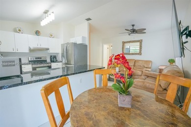 This charming 1988-built residence offers three bedrooms and two - photo 7
