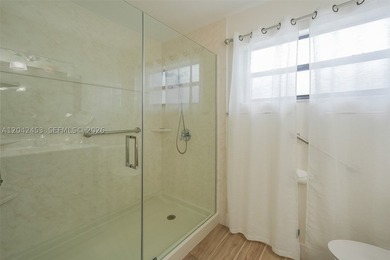 This charming 1988-built residence offers three bedrooms and two - photo 10