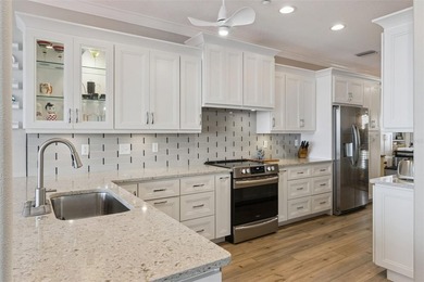 Set within a gated, waterfront community in Oldsmar, this - photo 16
