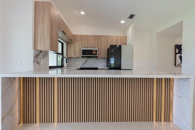 Welcome home to this extensively renovated lakefront home in the - photo 5