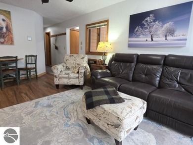 Comfortable in all seasons, this 2-bedroom condominium has