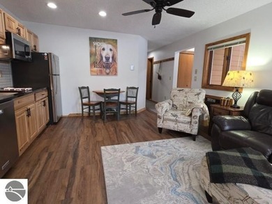 Comfortable in all seasons, this 2-bedroom condominium has