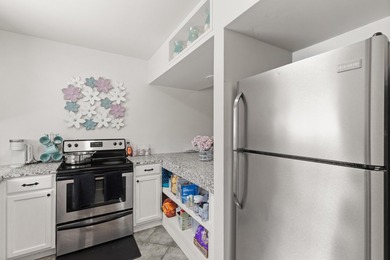 This renovated 2-bedroom, 2-bath condo has a newer roof (2022) - photo 5
