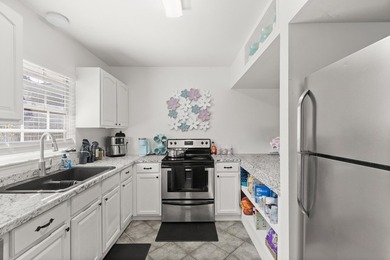 This renovated 2-bedroom, 2-bath condo has a newer roof (2022) - photo 7
